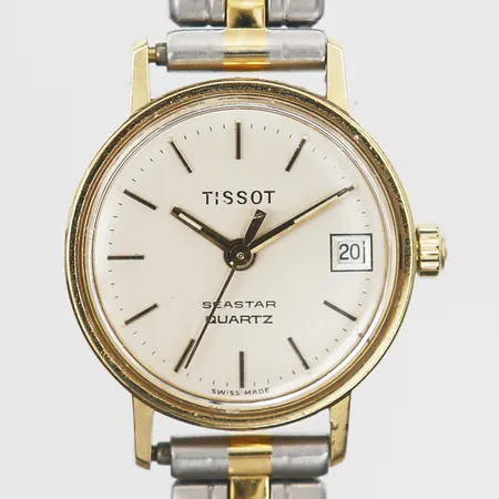 Damur Tissot Seastar Quartz, repigt plexiglas, gravyr på baksidan, går ej, armband i stål, boett i 18K guld, bruttovikt: 27,5g
