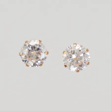 Ett par örhängen med vita stenar Ø 6,5mm, stift, GHA 18K Vikt: 1,2 g