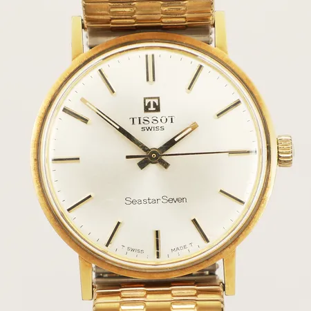 Herrur Tissot Seastar Seven guld manuell Ø33mm flexilänk guld på stål metall gravyr repor inga tillbehör 18K