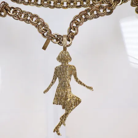 Collier Yves Saint Laurent "Silhouette Pendant" i gulmetall kedja längd 114cm längd hänge 15 cm, bruksslitage 