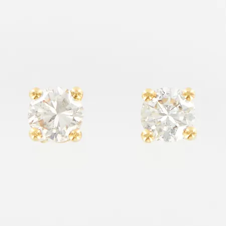 Ett par örhängen med diamanter, 2x ca 0,23 H/I SI2, en stopp i metall/plast, 18K Vikt: 1,1 g