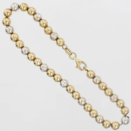 Armband med kulor, flera med bucklor, längd 19½cm, bredd 4mm, 18K guld Vikt: 4,3 g