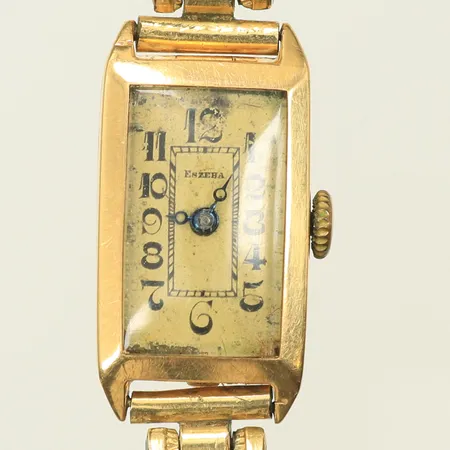 Damur Eszeha 22x14mm 18K i boett, länk i metall, defekt urverk. 