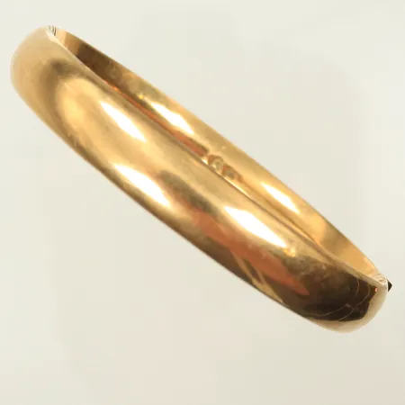 Armring öppningsbar  17cm omkrets, bredd 9mm, sliten, 14K Vikt: 16,6 g