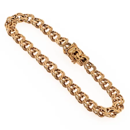 Armband Bismarck i 18K guld. Det är 19,7 cm långt, 7 mm brett och väger 16,6g. Kistlås. 