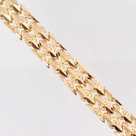 Armband mönstrat 19½cm, bredd 13,5mm, 18K Vikt: 27,1 g