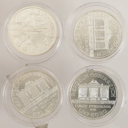 Fyra mynt, Wiener Philharmoniker 1 unze feinsilber 1,5 Euro, Ø37mm, 2011, plastetuier, 999/1000 silver Vikt: 125,5 g