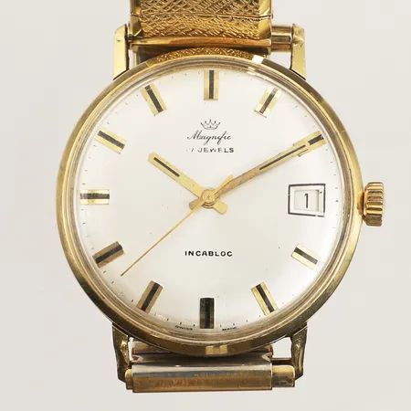 Herrur Magnific 18K, manuell, 34mm, boettnr 7819, datum, repigt plexiglas och boett, flexarmband i stål, ej original, inga tillbehör. 