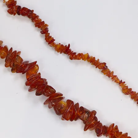 Collier med polerad Bärnsten längd ca 72cm bredd 9-20mm 