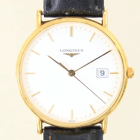 Herrur Longines, 18K, quartz, ref-nr: L4.692.6, serie-nr: 29566625, Ø33mm, safirglas, datum, läderband ej original med grovt slitage, gravyr, inga tillbehör 