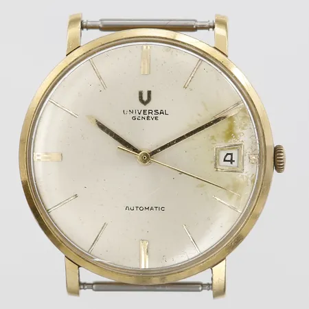 Herrur Universal Genevé, 18K guld, automat, datum, Ø36mm, skadad urtavla, repor.