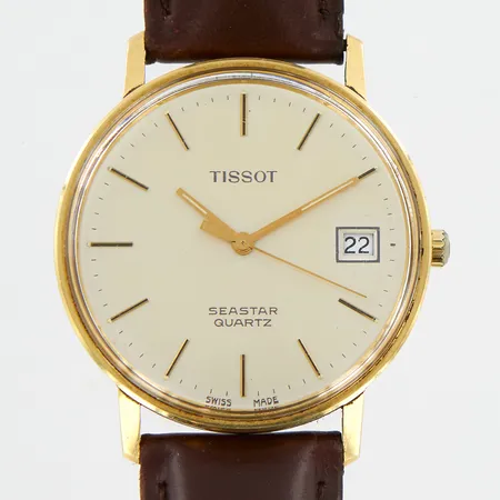Herrur Tissot Seastar 14K, quartz, Ø33mm, datum, gravyr, läderband 22,5cm, bruttovikt 27,6gram, repor på glas, i behov av batteribyte, inga tillbehör. 