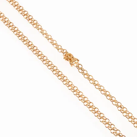 Collier X-länk i 18K guld. Det är 50 cm långt, 5 - 6 mm brett och väger 13,8g. Fint skick. Kistlås. Stämplad CCC (Guld Carlsén AB, Sundsvall), 18K och kattfot. 