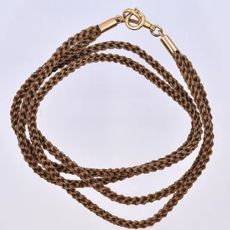 Collier med flätat hår med guldlås, längd 42,5 cm, 18K. Guld vikt ca 2g.