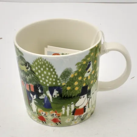 Muminmugg, Mumindalen Akvarell, år 2017, Arabia, Finland, porslin, höjd 8cm, Ø8cm, 30cl, märkt CR0217, ny med etikett samt berättelseetikett. Skickas med paket. Skickas med paket.