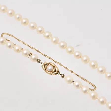 Pärlcollier 50cm bredd 6,75mm, lås och säkerhetskedja i 18K guld. Vikt: 0 g