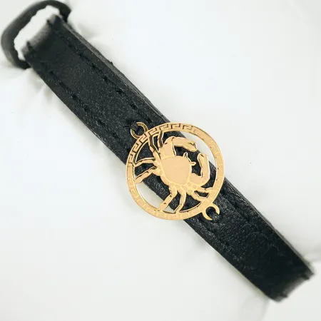 Armband konstläder med gulddetalj "kräfta" 18K, bruttovikt 7,9g (guldvikt ca 0,5g)