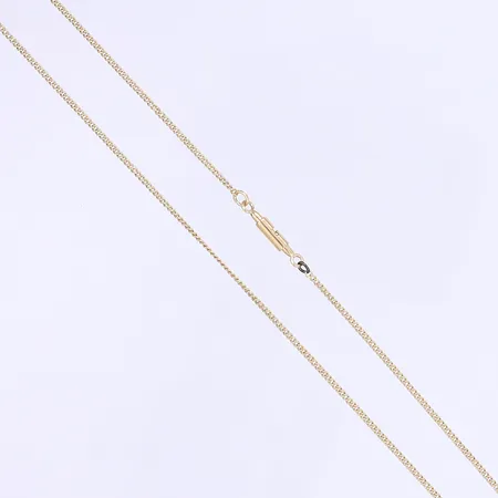 Lång kedja Pansarmodell längd 128cm, bredd 2mm, en ögla ej i guld, otydlig stämpel 18K Vikt: 13,8 g