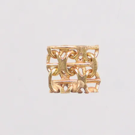 En bit guld X-länk 18K Vikt: 0,6 g