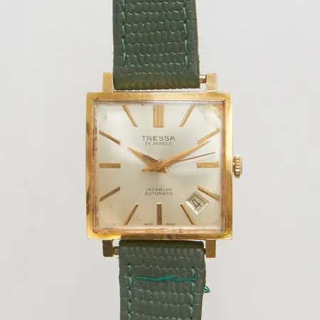 Armbandsur Tressa automat boett i 18K, 28x28mm, datum, repig, defekt läderband, repor på glas, bruttovikt 31,1g