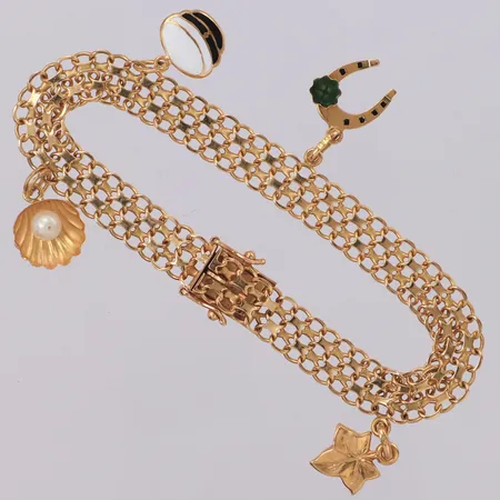 Armband X-länk med fyra berlocker, längd 18,5cm, bredd 7,9mm, 18K Vikt: 13,3 g