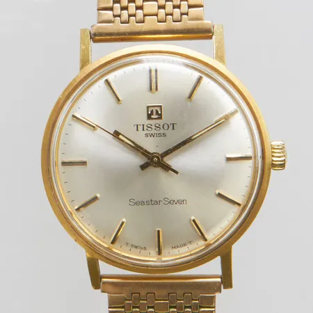 Herrur Tissot Seastar Seven Ø33,5mm, manuell, plexiglas, gravyr, boett i 18K, länk i stål, etui, bruttovikt 60,5g. 