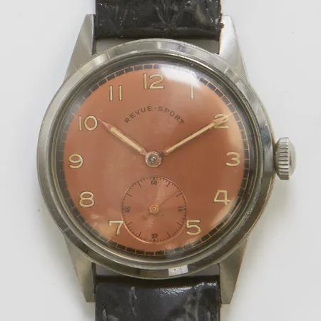 Armbandsur Revue-Sport Ø34mm, manuell, stål, liten sekundvisare, bortskrapat boett nummer, läderband.