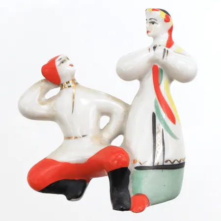 Figurin Hopak, dansande par i porslin, tillverkad av Polonsky ZHK, handmålad 1960-1970 talet, första sortering, "1-50" röd stämpel, höjd 7cm, bredd 6,5cm. Skickas med postpaket.