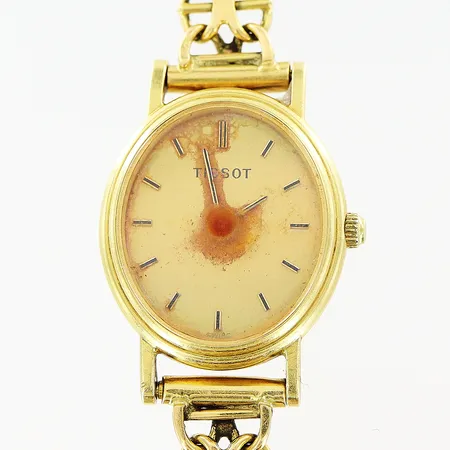 Damur Tissot 18K quartz 17mm, armband X-länk med stav längd 17,5cm, bredd 7mm, fungerar ej, defekt urtavla, gravyr, inga tillbehör, bruttovikt 18,4gram  Vikt: 18,4 g
