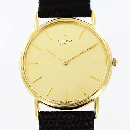 Herrur Seiko stål/gulmetall quartz Ø31mm, ref 5Y30-7000, serienr 704678, läderband 23cm, i behov av batteribyte, inga tillbehör.
