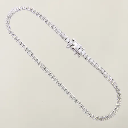 Stelt armband med vita stenar ANI Jewels längd 18cm bredd 2,4mm ojämnheter samt en länkbit defekt silver 925/1000 Vikt: 6,9 g