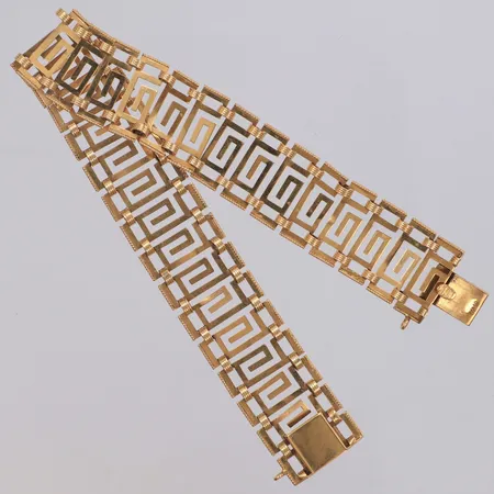 Armband längd 19cm, bredd 15mm, genombruten dekor, 18K Vikt: 14,8 g