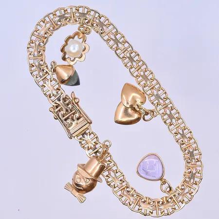 Armband X-länk med 5 berlocker längd 19,5 cm, bredd länk 7 mm 18K. Vikt: 17,4 g