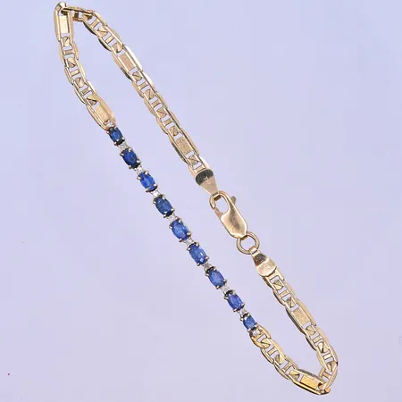 Armband med blåa stenar längd 20 cm, bredd 3-4 mm 18K. Vikt: 7,5 g