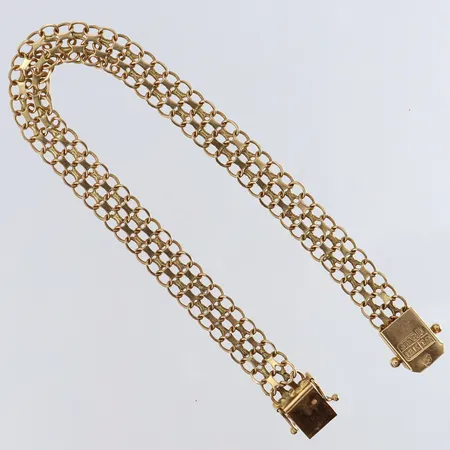 Armband X-länk längd 18,5cm bredd 7,5mm 18K.  Vikt: 9,1 g