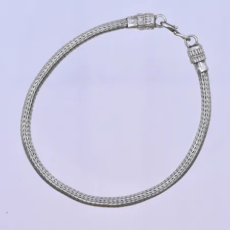 Armband längd 19,5 cm, bredd 4 mm silver 830/1000. Vikt: 9,8 g