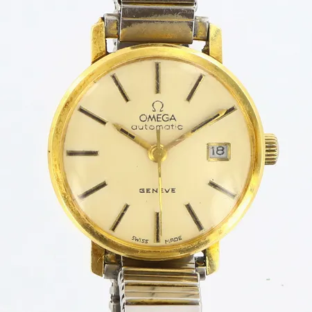 Damur Omega Geneve 18K automatisk Ø23mm, 18K i boett, krona och flexilänk i metall, glas repig, bruksslitage, bruttovikt: 32,79 gram