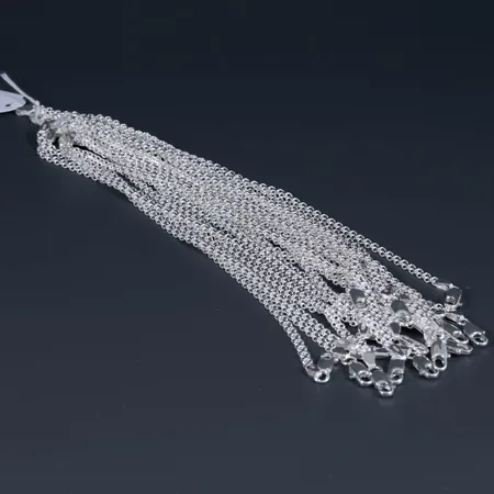20 oanvända armband x-länk i silver 925/1000. Längd 19 cm, bredd 3,3 mm. Karbinhake. Totalt 71,4g.