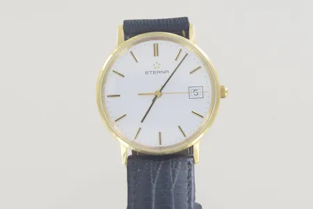 Herrur Eterna diam 33 mm, graverad 18K , Batterie behöves 