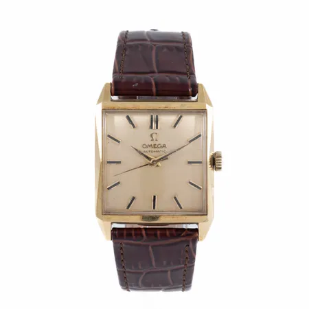 Herrur Omega Automatic guld 18K 28x29mm plexiglas, original glas, brunt läderband, gravyr, löst lock, 18K bruttovikt: 43,7g.