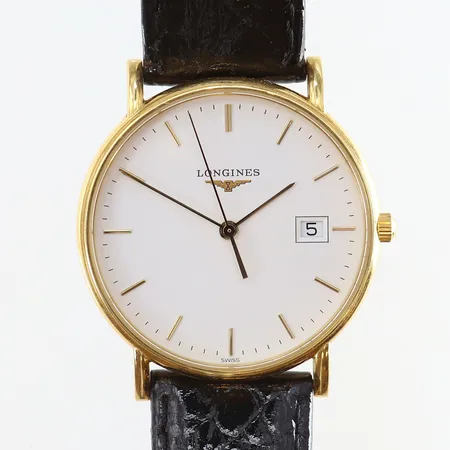 Herrur Longines 18K quartz Ø33mm ref-nr:47436122 serie-nr:34124567 läderband med slitage garantikort 2008 etui med slitage/skador gravyr går ej. 