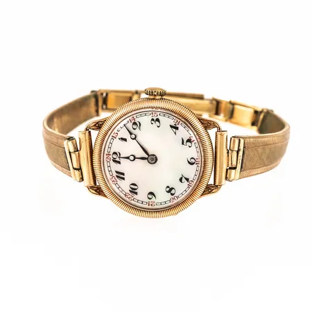 Defekt damur 14K med pärlemorurtavla. Boett Ø 22,7 mm. Metallband. Manuellt urverk- går ej. 