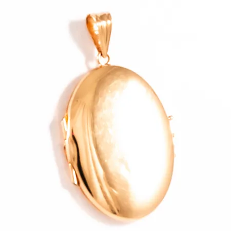 Hänge medaljong bredd 24mm längd inkl ögla 41,5mm, svag buckla fram, glas invändigt sitter löst, 18K 6,5g.