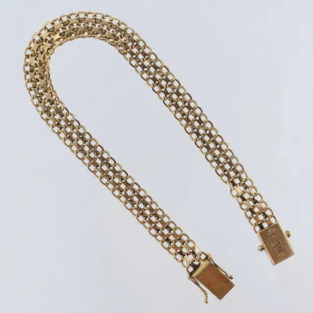 Armband X-länk längd 19,5cm bredd 7,5mm trögt lås 18K.  Vikt: 11,2 g