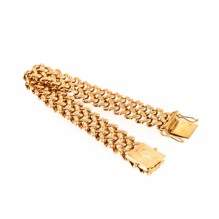 Armband i 18K guld. Längd 17 cm. Bredd 12,4 mm. Kistlås. Aningen ojämnt. Vikt: 27,3g Vikt: 27,3 g