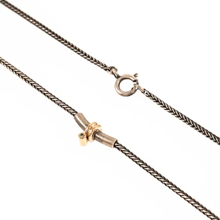 Collier med en briljantslipad diamant ca 0,02ct fattad i 14K guld längd 43cm bredd 1,7mm, defekt springring, silver 925/1000 7,3g.  