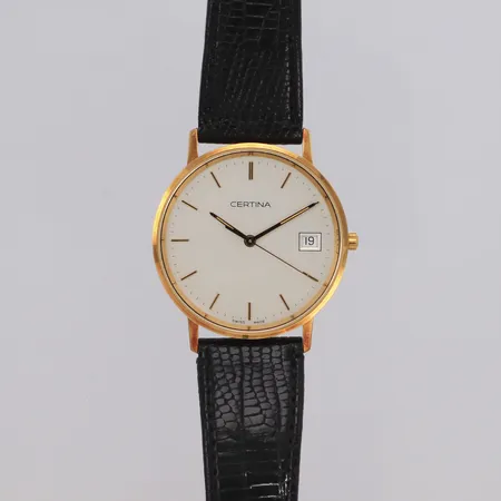 Armbandsur Certina 18K Ø34mm, quartz, datum, svart läderband, går ej, gravyr, inga tillbehör