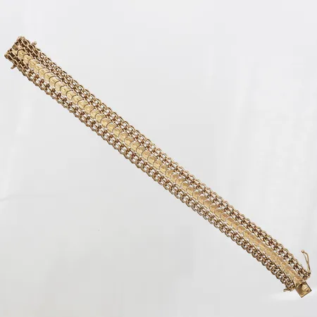 Armband längd 19cm, bredd 14mm, säkerhetskedja saknas, 18K. Vikt: 35,6 g