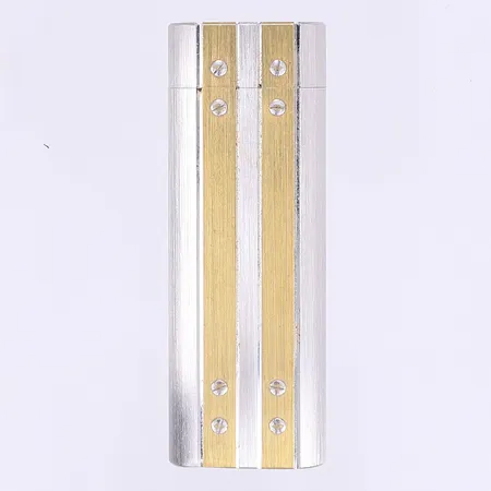 Tändare Cartier Paris serienummer C42544, borstat stål med förgyllda detaljer, slitage, fungerande vid test, inga tillbehör