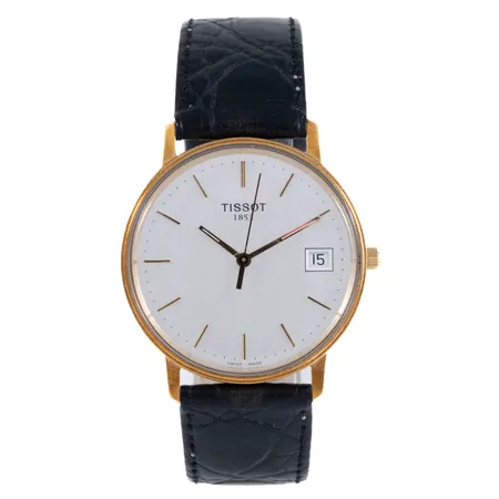 Herrur Tissot 1853 guld 18K Ø33,5mm quartz, datum, plexiglas, svart läderband, något repigt glas, gravyr. Går ej - Batteribyte krävs? Bruttovikt: 31,8g. 